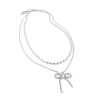 Silver dangling bow necklace with crystal bow pendant and fine chain links.