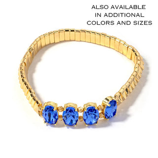Gold-tone bead bracelet with four blue oval crystal charms in gold settings