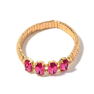 Gold-tone bead bracelet with four dark pink oval crystal charms in gold settings