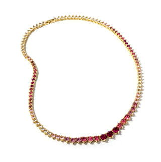 Gold-tone tennis necklace with pink gemstone-like prong-set stones