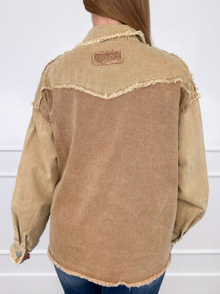 Back view of tan cotton denim jacket with frayed yoke and button cuff detail