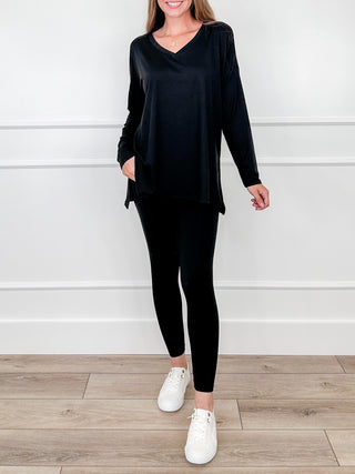 High-rise cropped leggings set in black, V-neck tunic top with long sleeves and fitted leggings