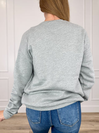 Grey crewneck sweatshirt with long sleeves, back view on model