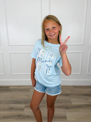 Kids light blue short-sleeve graphic tee with 'Mini' print, worn by child