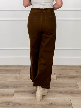 Brown high-rise wide-leg denim jeans with zip/button front and back pockets