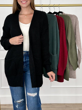 Black knit long-sleeve cardigan with open front and ribbed hem and cuffs