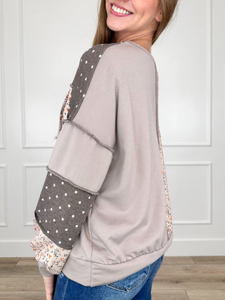 Brown knit long-sleeve colorblock top with taupe back panel and polka-dot side
