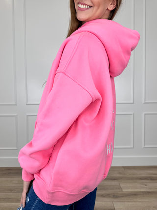 Pink hooded pullover sweatshirt, long sleeve with drawstring hood, front pocket, graphic