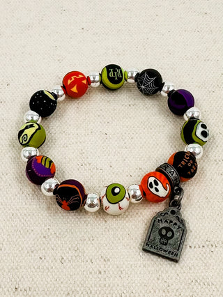 Kids spooky silver bracelet with Halloween-themed bead charms and dangling tag charm