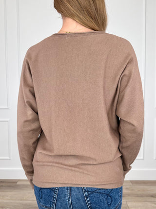 Brown knit long-sleeve sweater, back view with crew neck and ribbed cuffs