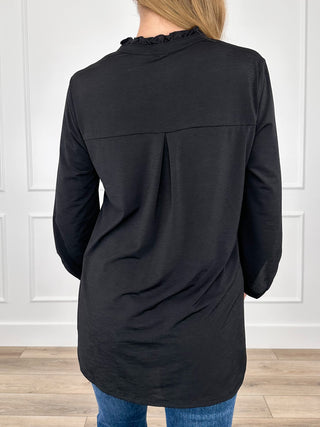 Black gabby top back view with 3/4 sleeves, V-neck, and curved hem