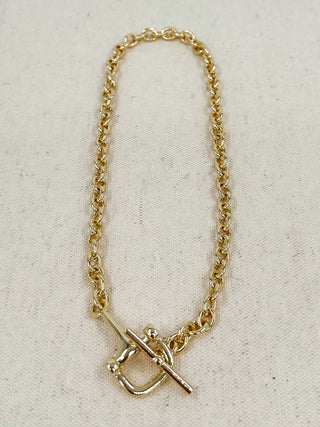 Gold-tone chain necklace with square pendant and cross detail