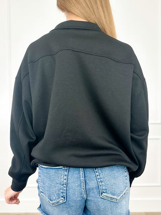 Dark charcoal quarter-zip pullover sweatshirt, long sleeves, half zipper