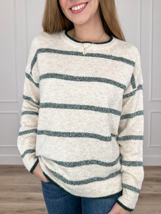 Oatmeal knit crewneck sweater with long sleeves and green striped bands