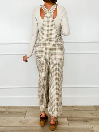 Cream check cotton overalls with open back and adjustable shoulder straps, wide legs