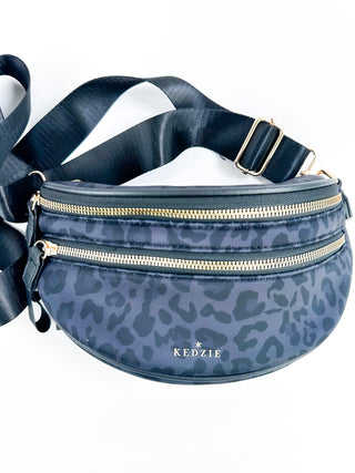 Blue leopard print neoprene crossbody bag with adjustable strap and twin zip pockets