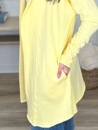 Yellow cotton-blend hooded cardigan with side pocket and long sleeves