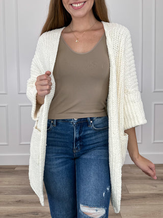 Ivory open-front knit cardigan with 3/4 sleeves, chunky textured fabric