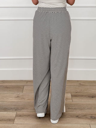 High-rise striped knit wide-leg pants, relaxed back view in gray