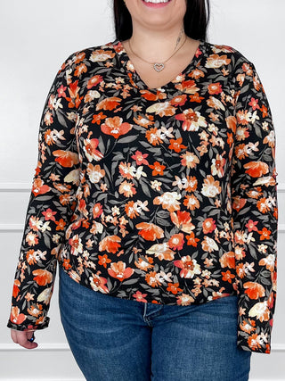 V-neck long-sleeve floral top, black with orange and white flower print
