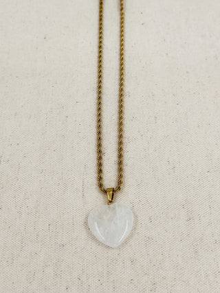 Gold heart pendant necklace with white heart charm