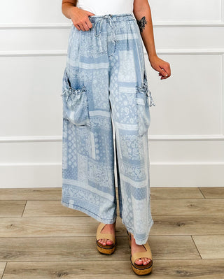 Lightweight blue high-rise wide-leg cargo pants with patchwork print and elastic waist