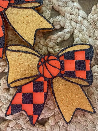 Tan felt sideline sparkle bow with orange checker accents and orange center flower