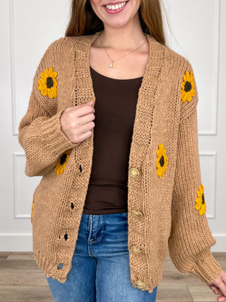 Tan knit long-sleeve button cardigan with yellow sunflower patches