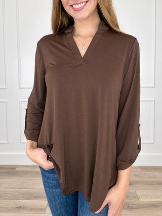 Brown gabby top with V-neck and 3/4 sleeves, loose tunic hem