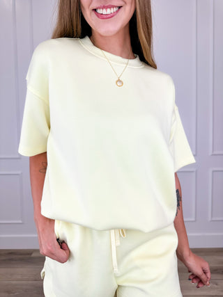Lightweight short-sleeve crewneck top, pale yellow, loose drape