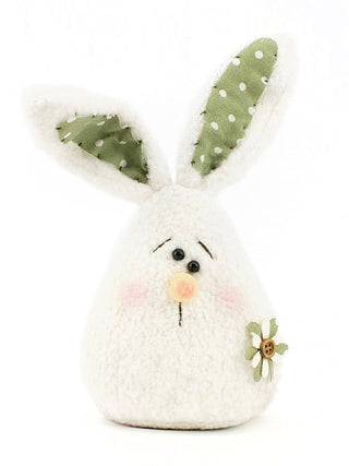 White plush rabbit decor with green polka-dot ears, pink nose, and small flower with bee