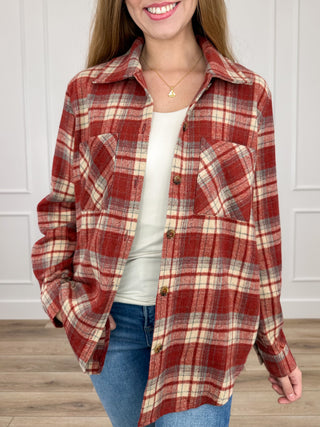 Brick red plaid flannel shacket, long sleeves, button-up front, chest pocket