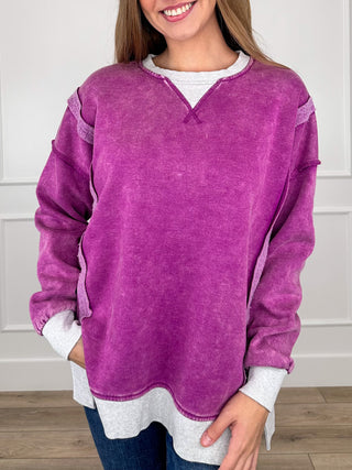 Women's purple long-sleeve V-neck pullover top with contrast white hem and cuffs