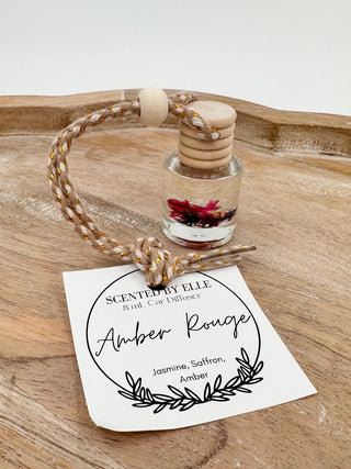Glass scent diffuser bottle with wooden stopper and rope cord, label: Amber Rouge