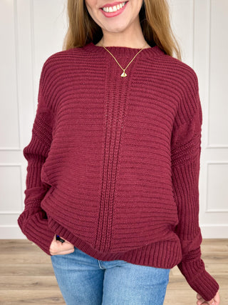 Wine red knit long-sleeve sweater with ribbed hem and cuffs, front view, round neckline