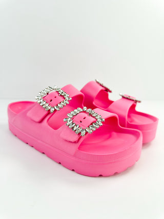 Pink platform double-strap slide sandals with jeweled square buckles