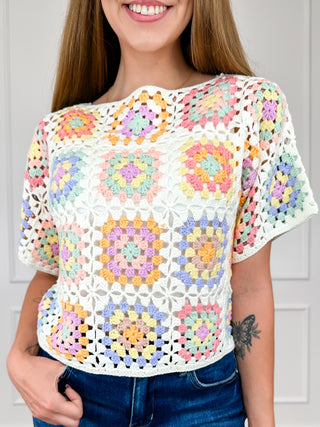 Multi-color crochet short sleeve sweater top with openwork granny squares, crew neck