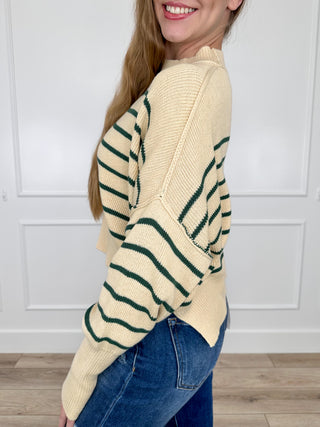 Cream knit cropped sweater top with long sleeves and green striped side view
