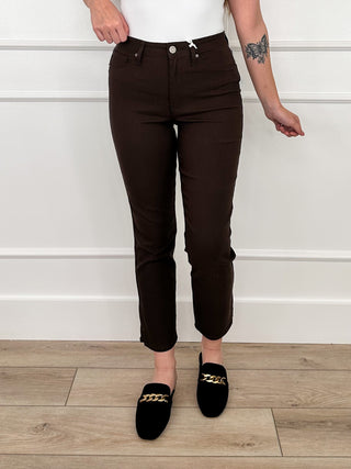 Dark brown high-rise straight leg bottoms with belt loops and buttoned front