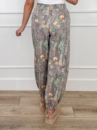 Women's camo print joggers with elastic waist and relaxed tapered legs, gathered cuffs