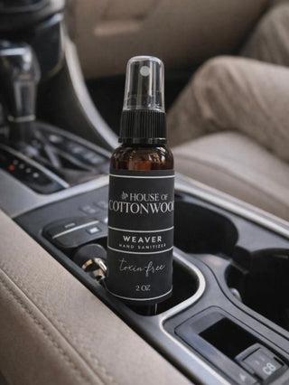 Hand sanitizer spray bottle, Weaver scent, 2 oz, clear pump in car cupholder