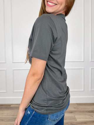 Grey short-sleeve cotton tee with partial front graphic, side view