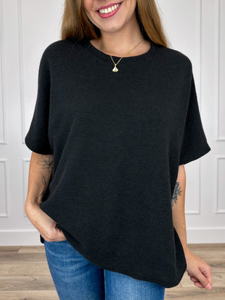 Black knit short-sleeve top with crew neck, relaxed drape and straight hem