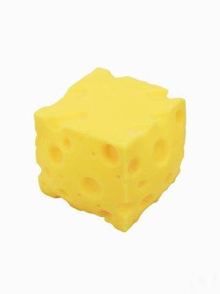 Yellow foam cheese squishy with cartoon face and small holes