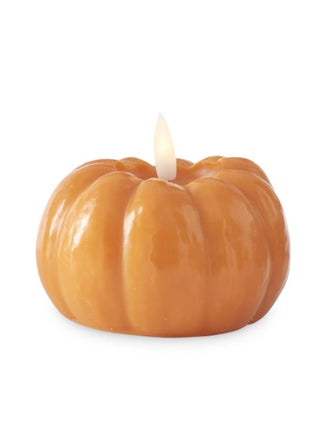 Amber-orange pumpkin-shaped LED candle with glowing flame wick