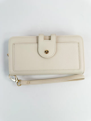 Faux leather wallet, off-white, front snap flap, wrist strap, gold hardware.