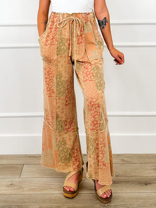 High-rise wide-leg pants with drawstring waist and patchwork floral print, front view