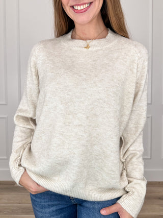 Oatmeal knit mock-neck sweater top with long sleeves and relaxed fit