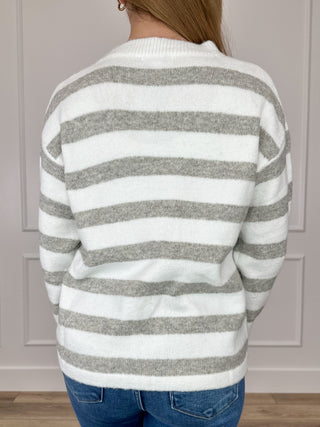 White and gray striped knit long-sleeve sweater with crew neck, back view