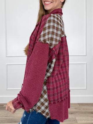 Berry and tan plaid long sleeve button-up top with frayed hem and button cuffs